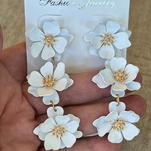 White and gold flower drop earrings pierced
